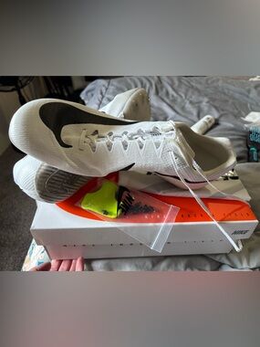 Nike track shoes, comes with box, nike bag, spike tool and spikes. Son wore once